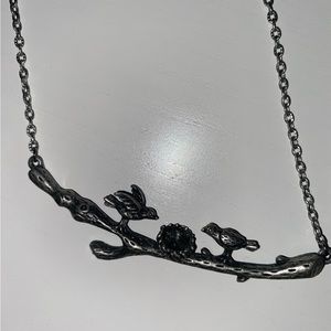 Necklace with birds on a log